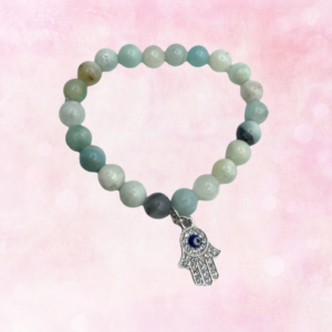 Embrace harmony and protection with the Amazonite Hamsa Bracelet, a talisman of balance, calming energy, and positive vibes.