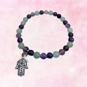 "Experience harmony and protection with our Fluorite with Hamsa Bracelet. Embrace its healing energy and elevate your spiritual journey."