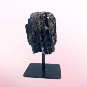 Unearth the mystique of Rough Black Tourmaline, a powerful gem that shields from negativity, grounds, and fosters spiritual growth.