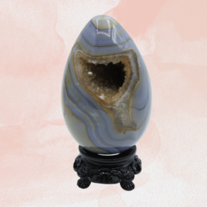 Unleash serenity and beauty with the Egg Blue Lace Agate Druzy Carving. A mesmerizing addition to your collection.