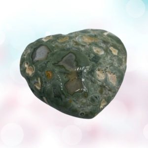 The Diopside heart is a symbol of love, healing, and nature's beauty. Enjoy its radiant green hues in elegant gemstones. Treasured in jewelry."