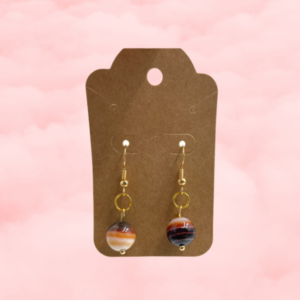 Discover the beauty and versatility of banded agate earrings, showcasing unique patterns and colors. They hold both aesthetic and metaphysical appeal.