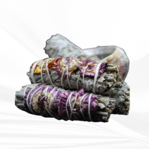 Cleanse and uplift your space with our White Sage and Purple Flower smudge stick. Experience the positive energy of these natural elements in your home or sacred area.