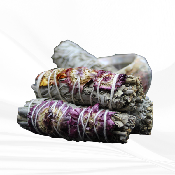 Cleanse and uplift your space with our White Sage and Purple Flower smudge stick. Experience the positive energy of these natural elements in your home or sacred area.